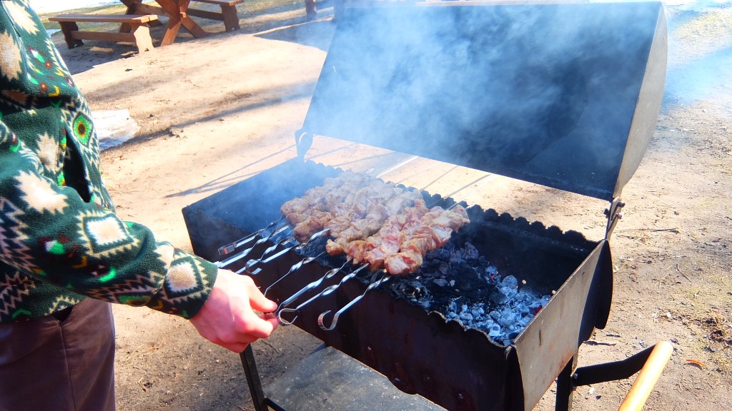 Skewers cooking on a barbecue grill
